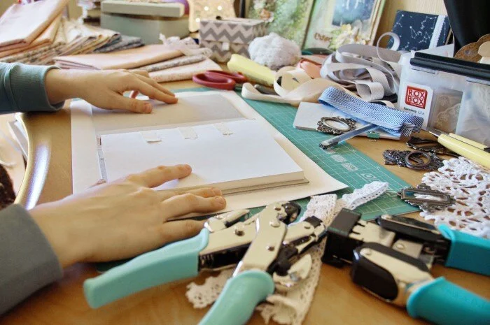 Woman prepares to create scrapbook memory book