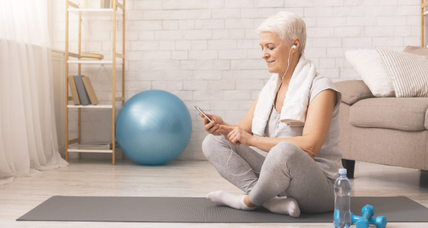 senior woman resident of The Bristal in a yoga class