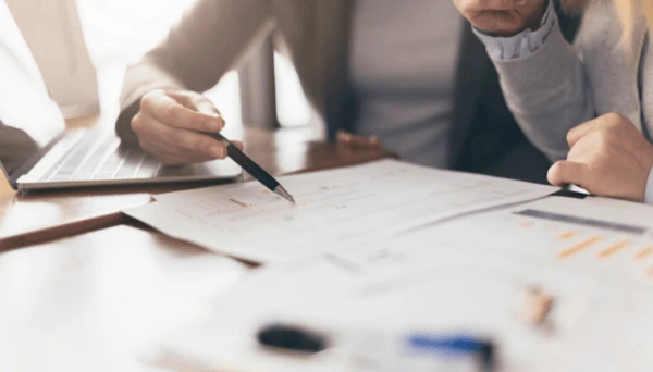 Social worker sorting through dementia caregiver paperwork