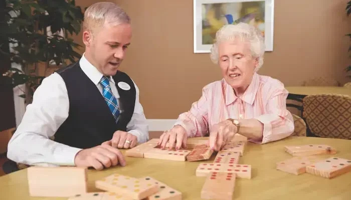 reflections resident playing dominos