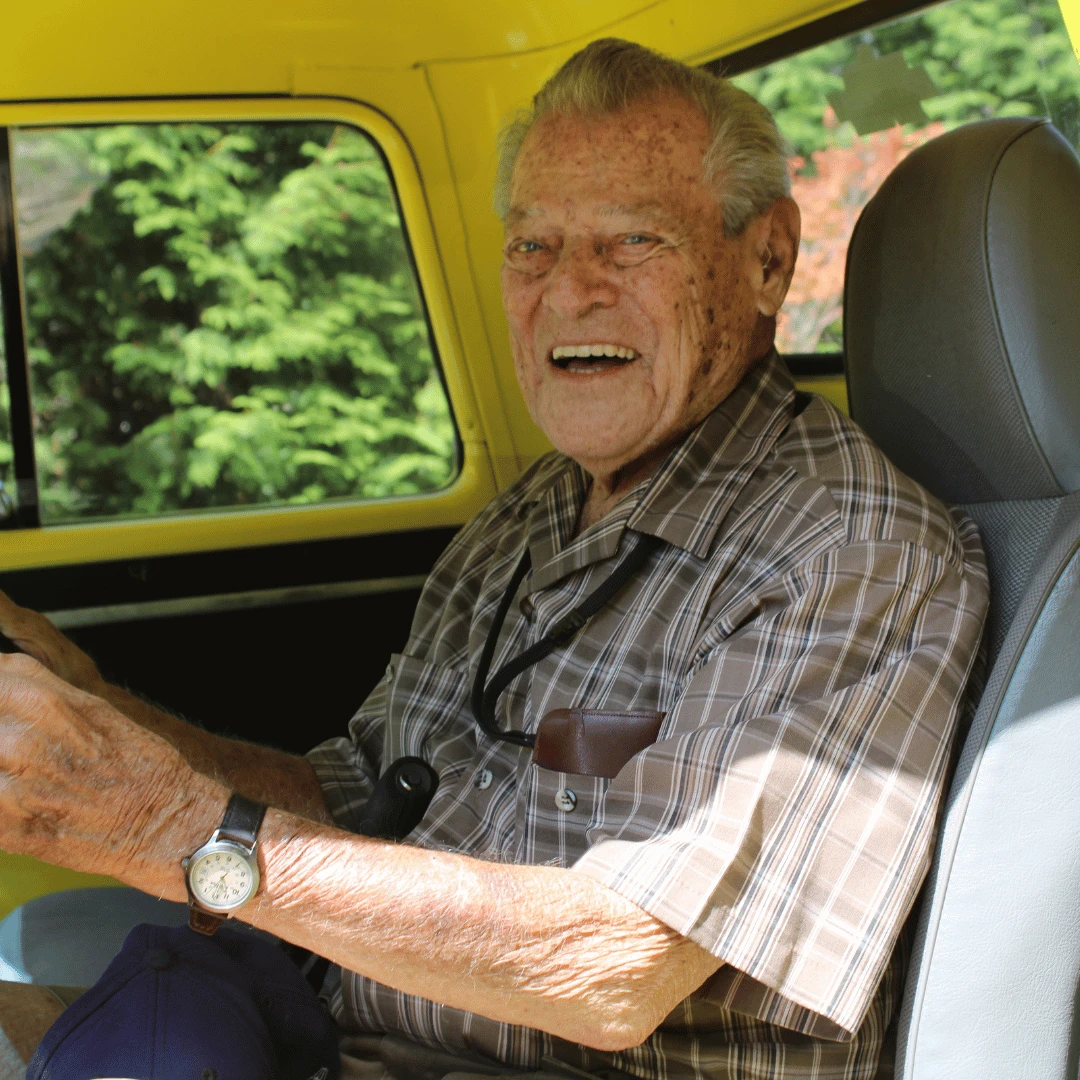 Senior resident behind the wheel of a 1957 Chevy Pick-up Truck at The Bristal at Woodcliff Lake Car Show.