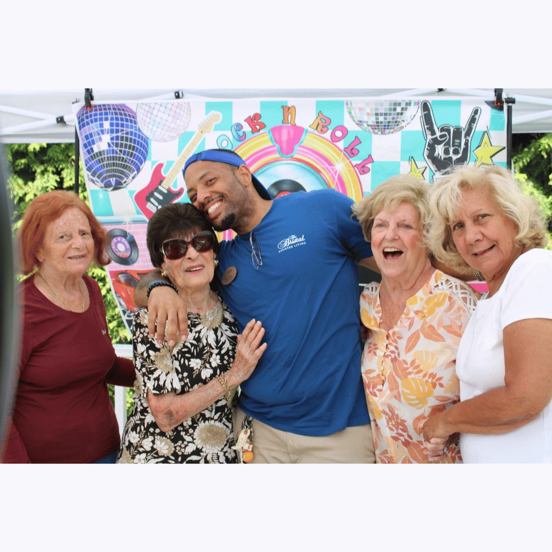 Residents posed for pictures in the Rock N Roll Photo Booth at the Classic Car Show.