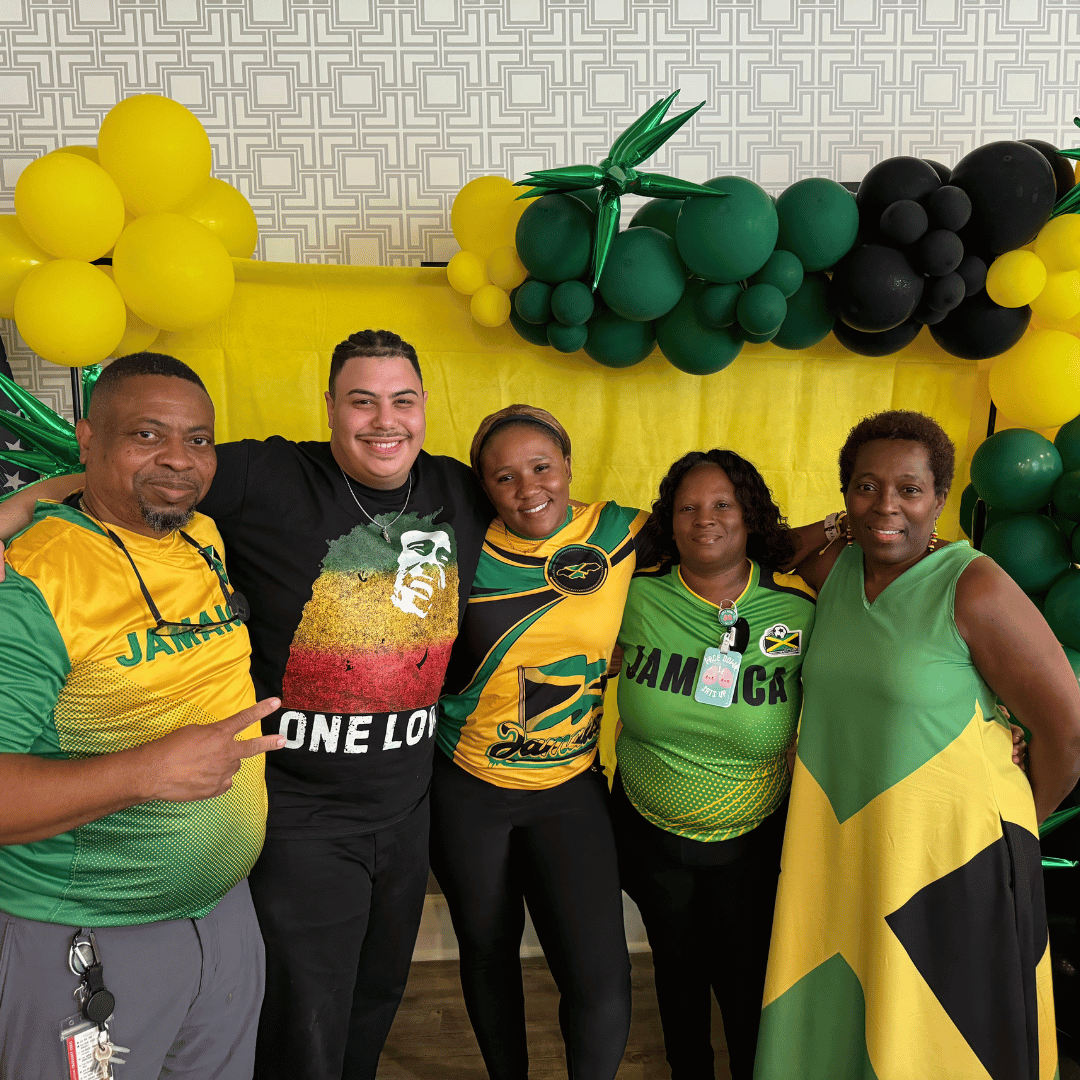 Residents and team members dressed in yellow and green to honor the Jamaican flag.
