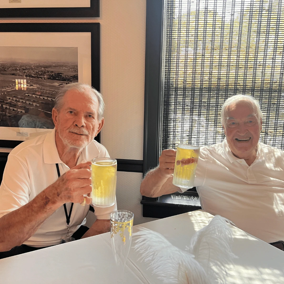 Two gentlemen raise a toast during the much-anticipated event!