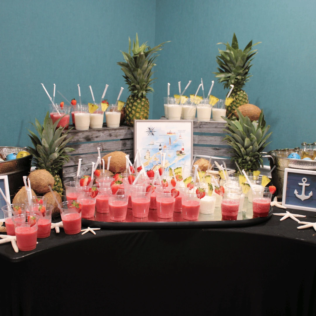 A self-serve beverage station offering strawberry daquiris and pina coladas.