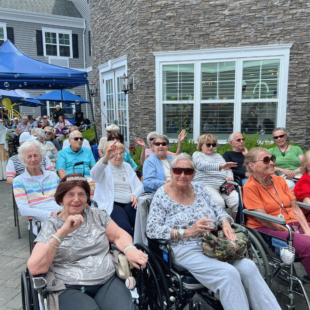 Resident relaxed poolside to enjoy the afternoon entertainment at the West Babylon pool party.