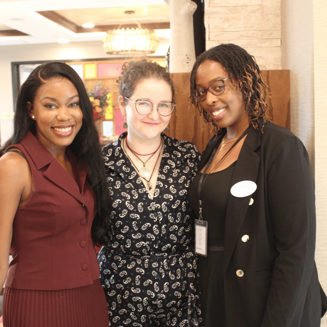 Author Margaret Hall posed for pictures with residents and team members.