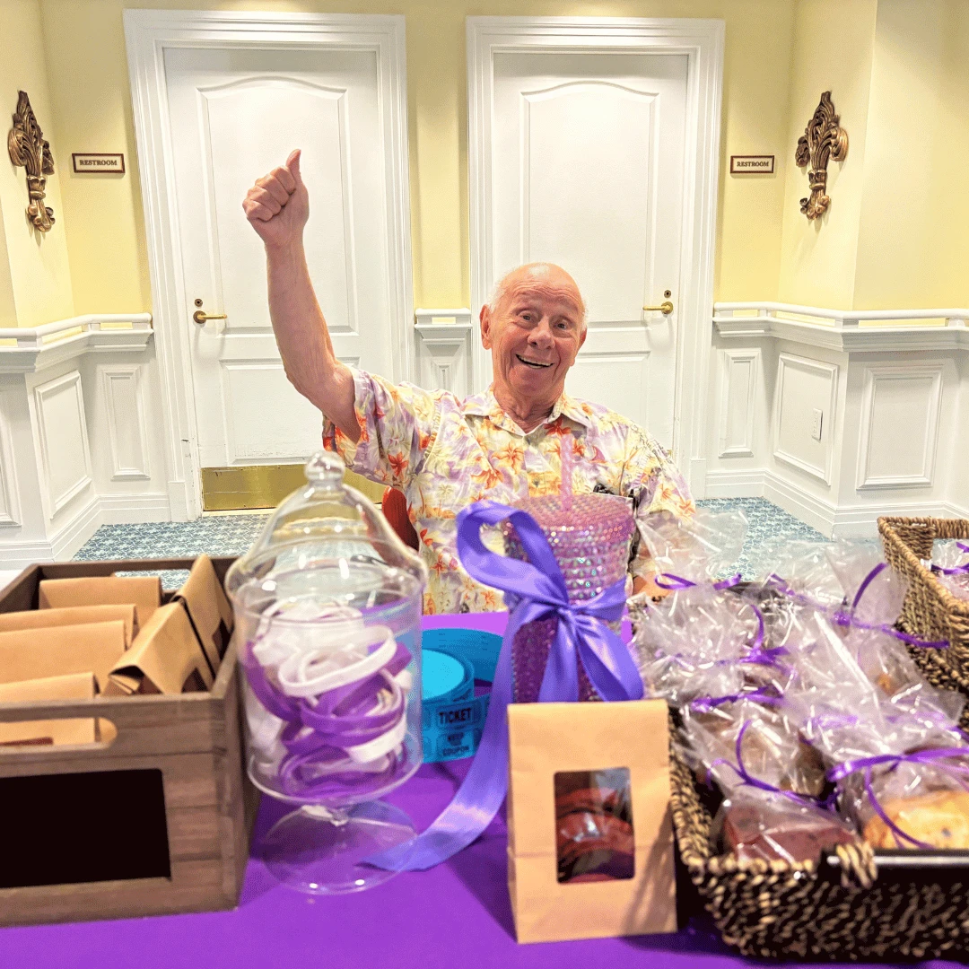 Resident of The Bristal at North Woodmere gives a thumbs up, indicating his support of the Alzheimer's Association Walk to End Alzheimer's cause.