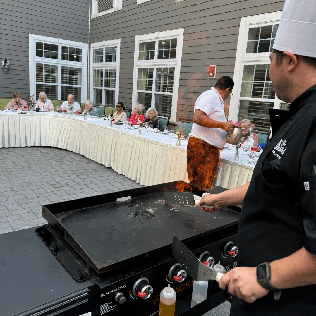 Food Service Director John entertained residents as he cooked various entrees and sides.