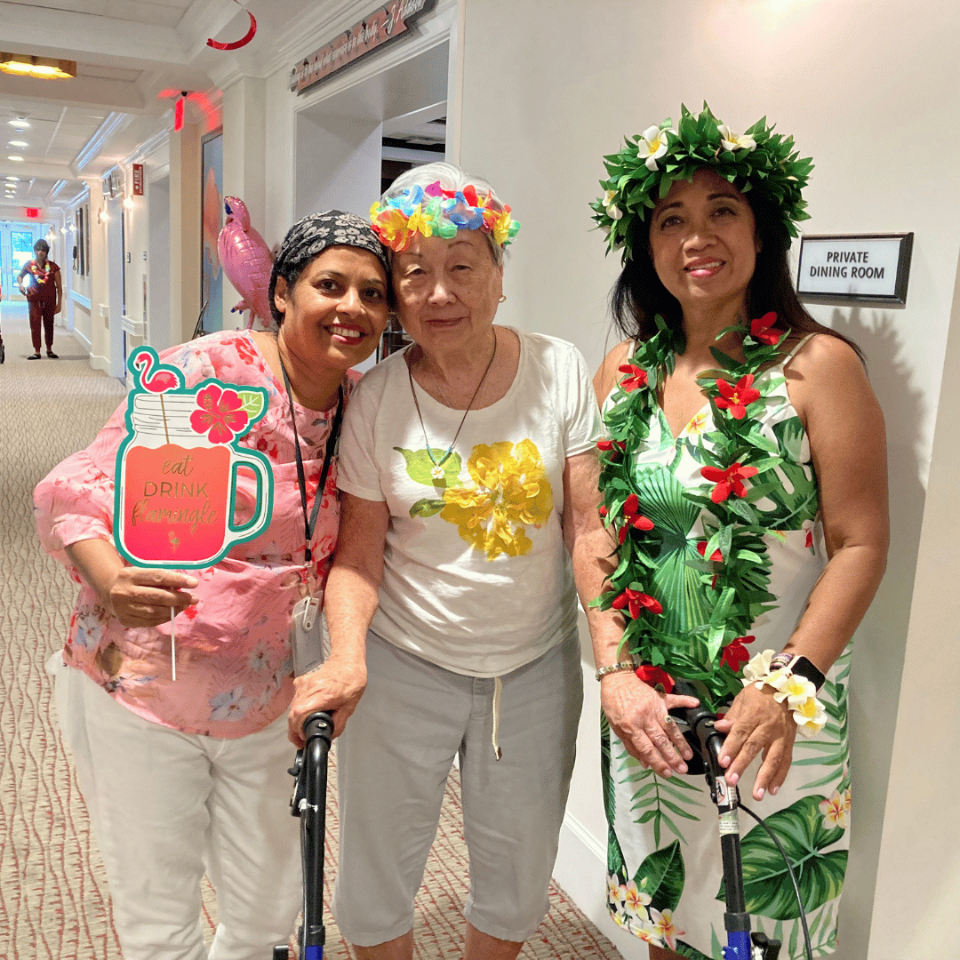 Garden City seniors enjoyed posing for pictures with traditional Hawaiian dancers at the luau hosted by The Bristal.