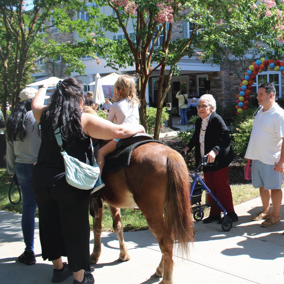 Residents and their families enjoyed taking pony rides.