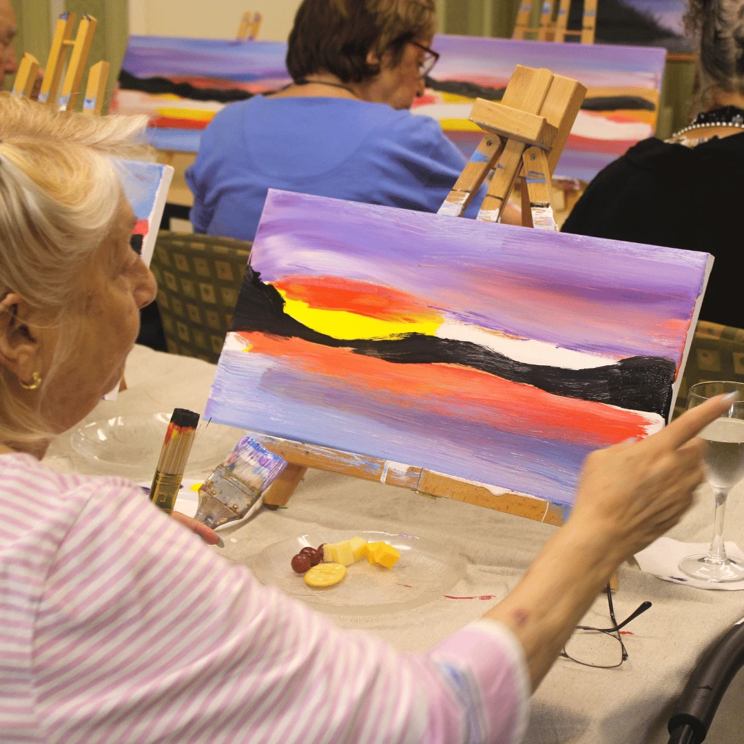Residents enjoyed sipping wine and juice, and eating fruit, cheese and crackers while painting.