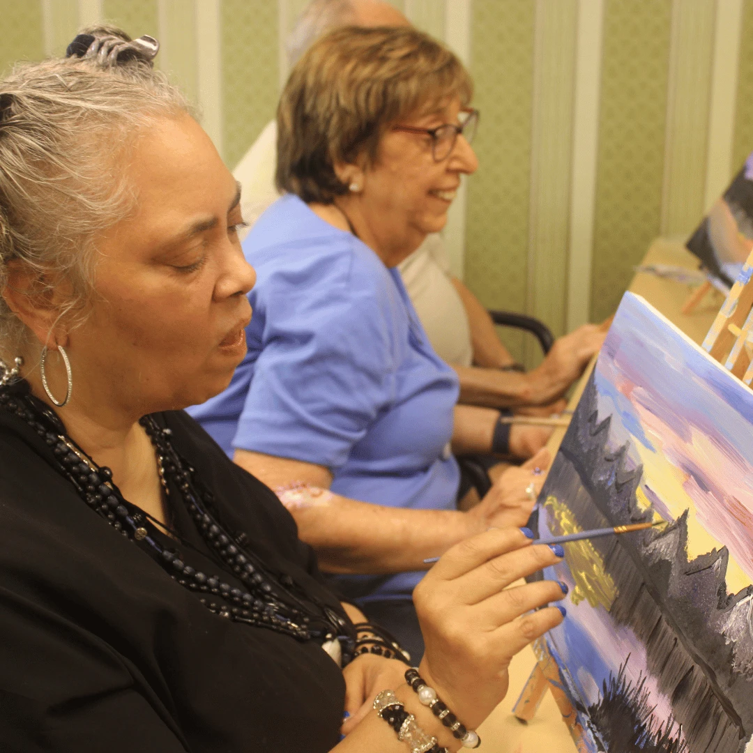 Residents painted their version of a mountainside lake at sunset.