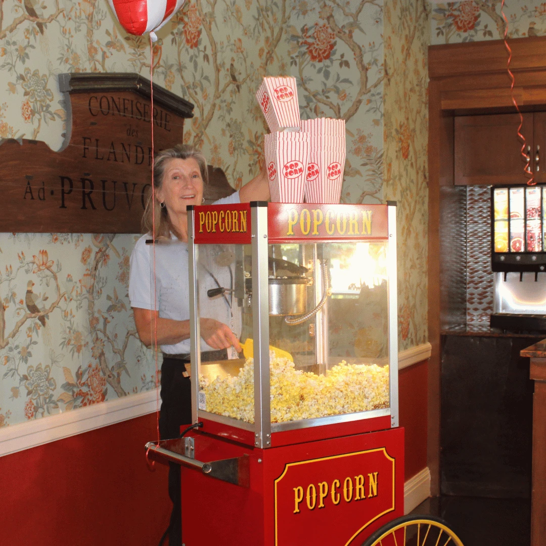 Carnival foods, like freshly popped popcorn, was a highlight of Grandparents Day at Woodcliff Lake.