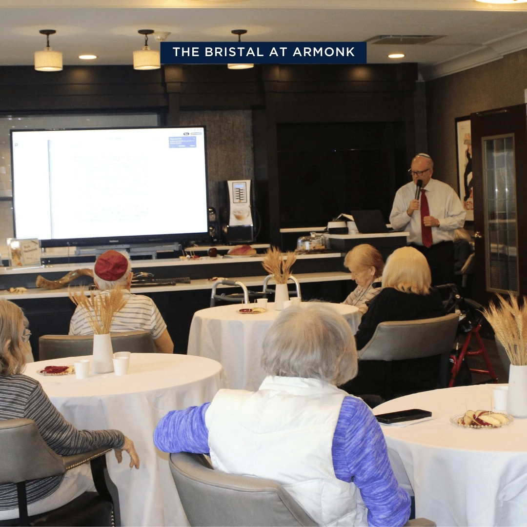 Rabbi presiding over Rosh Hashanah service at The Bristal at Armonk