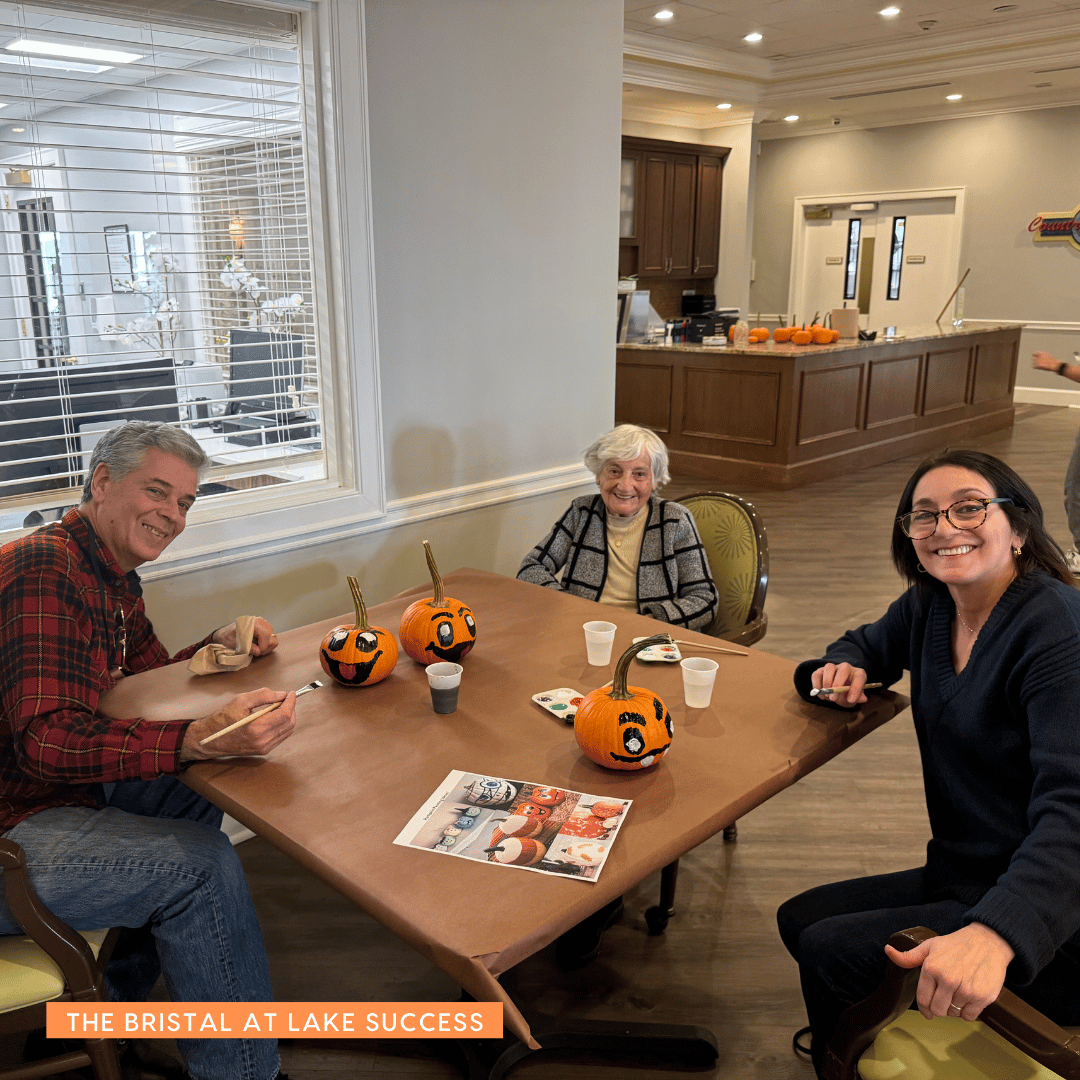 Residents at The Bristal at Lake Success painted pumpkins with family members to celebrate Halloween.