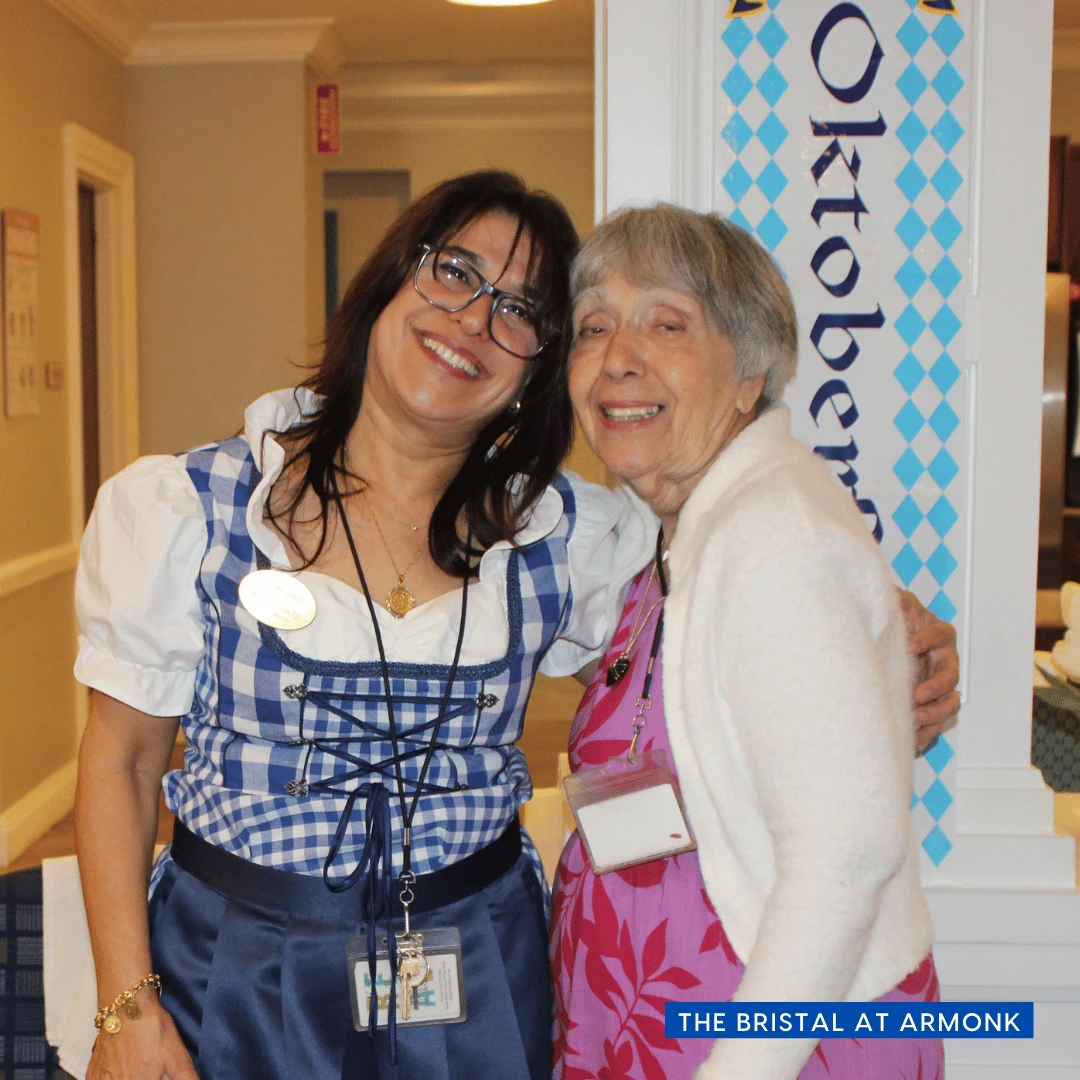 Oktoberfest at The Bristal at Armonk - staff and resident pose together 