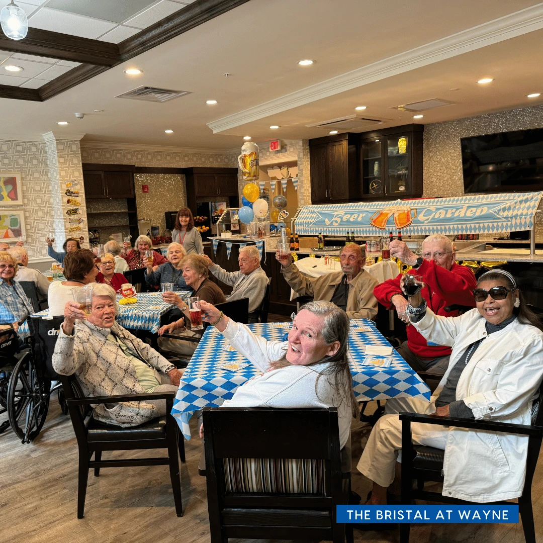 Seniors at The Bristal at Wayne raise a glass to toast Oktoberfest celebrations.