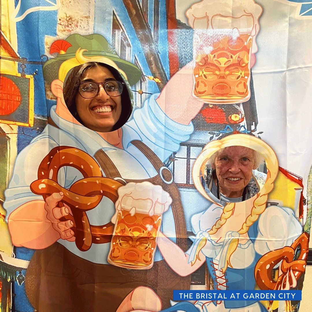 Residents and team members from The Bristal at Garden City posed for photos in a fun, Oktoberfest-themed photo cut-out.