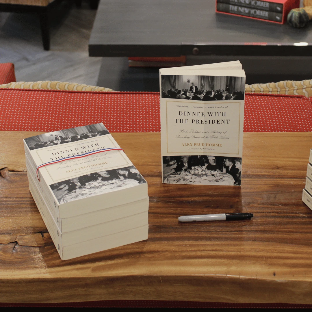 stacked copies displaying Dinner with the President by Alex Prud'homme