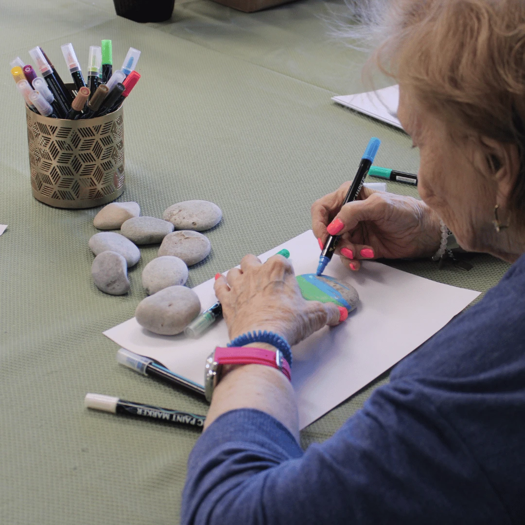 Lynbrook resident paints a message of hope in teal on a rock.