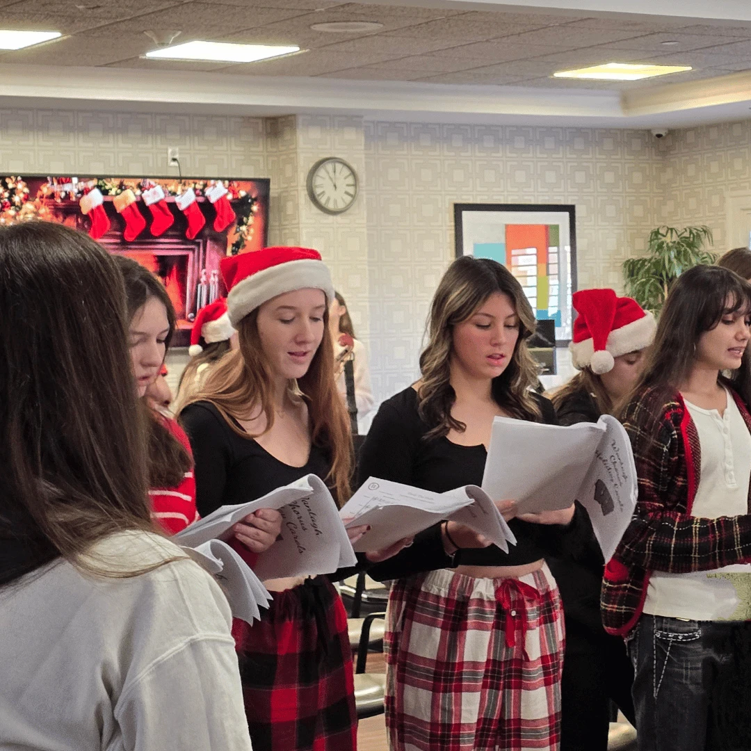 members of the Wantagh High School chorus sang festive holiday tunes
