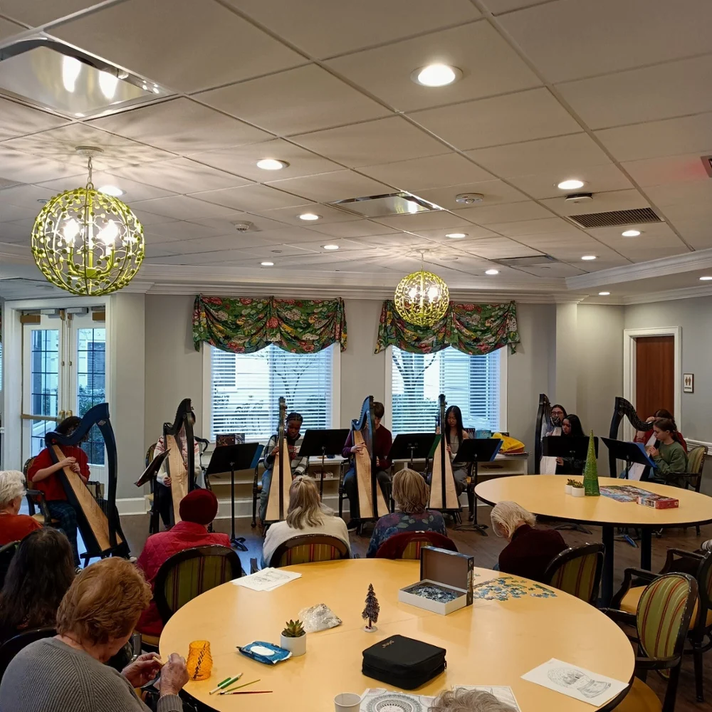 The Longwood High School Harp Ensemble performed holiday tunes for residents.