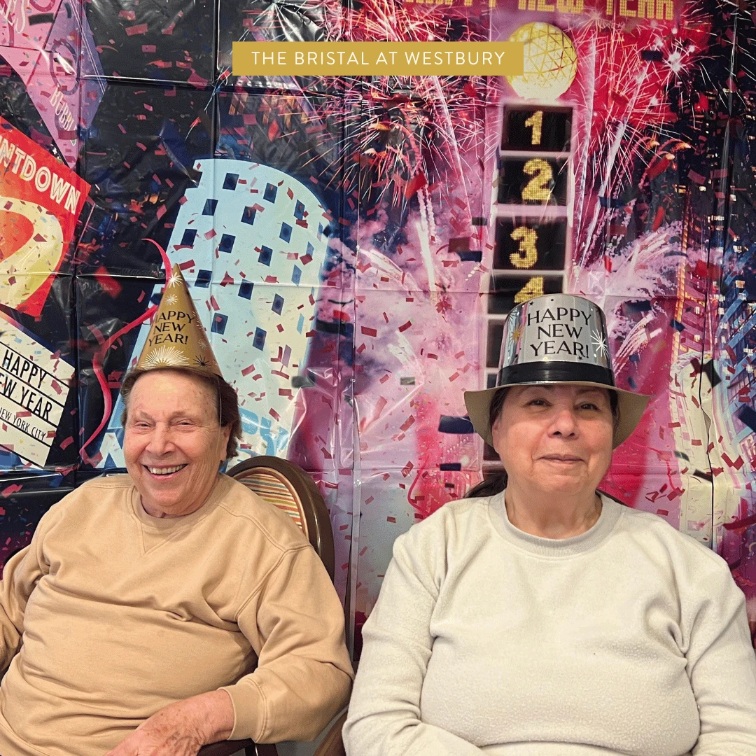 Residents at The Bristal at Westbury wearing New Years hats 