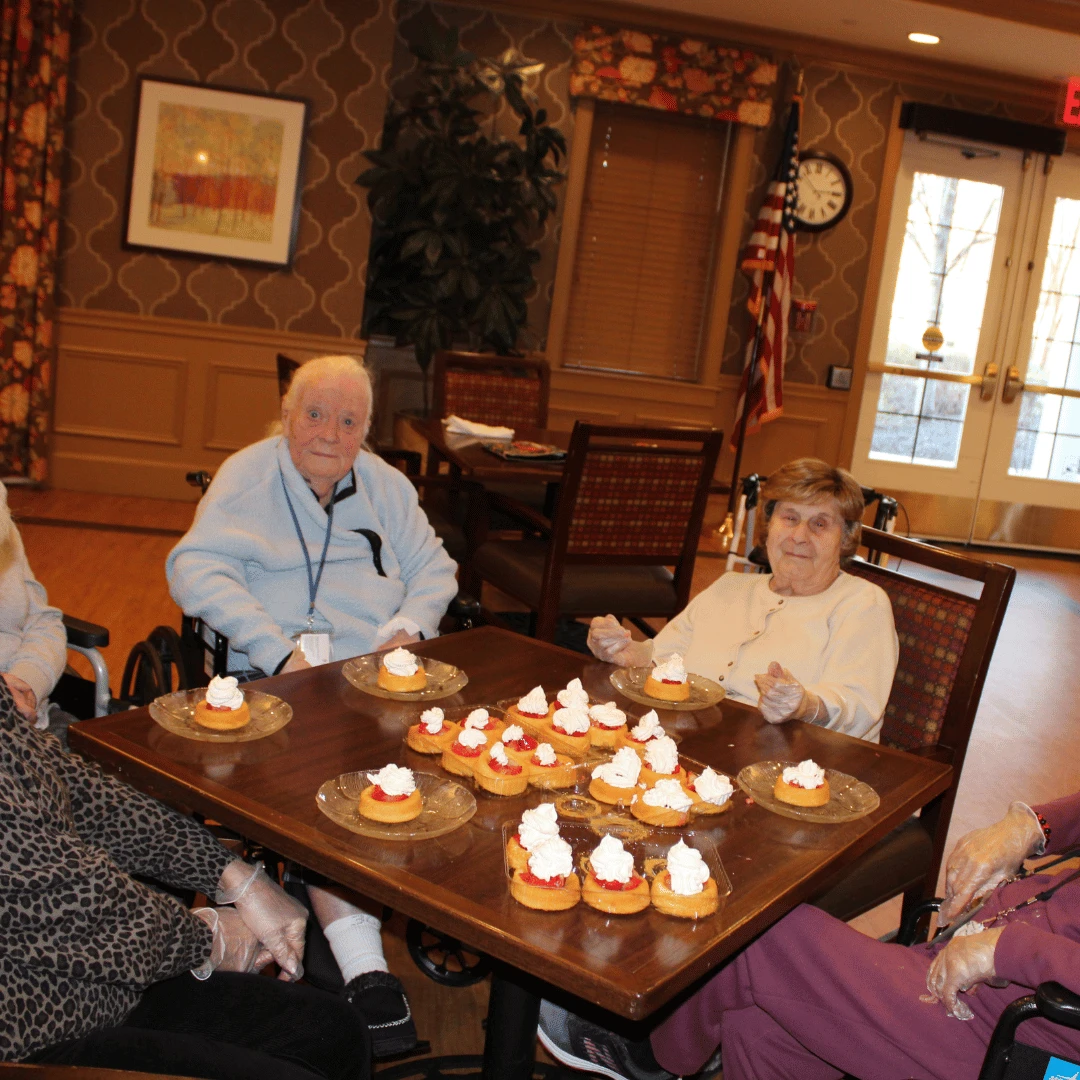 Residents in the Foodies Club prepare snacks for Social Hour at Lake Grove.