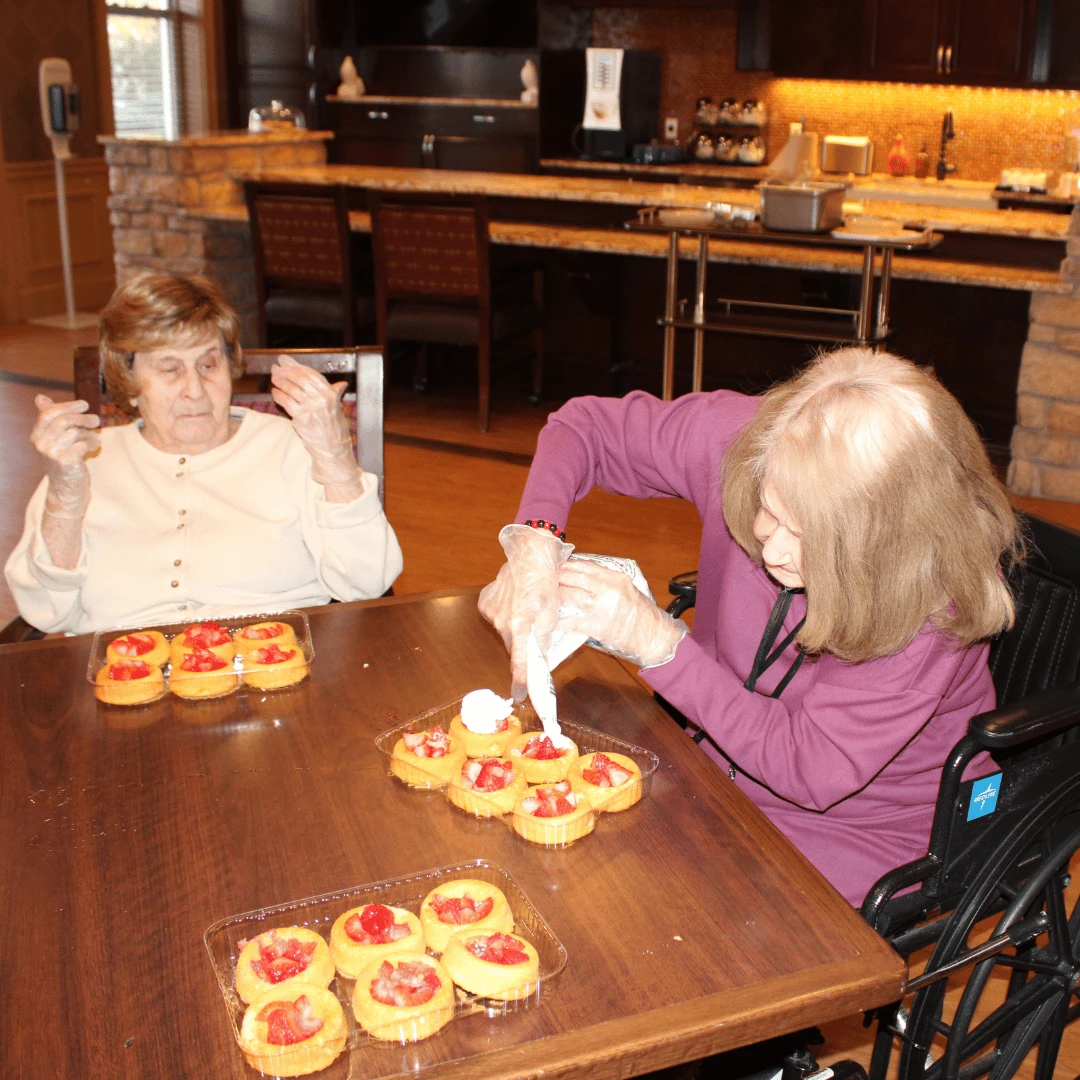 Lake Grove resident pipes whipped cream on the strawberry shortcake treat.