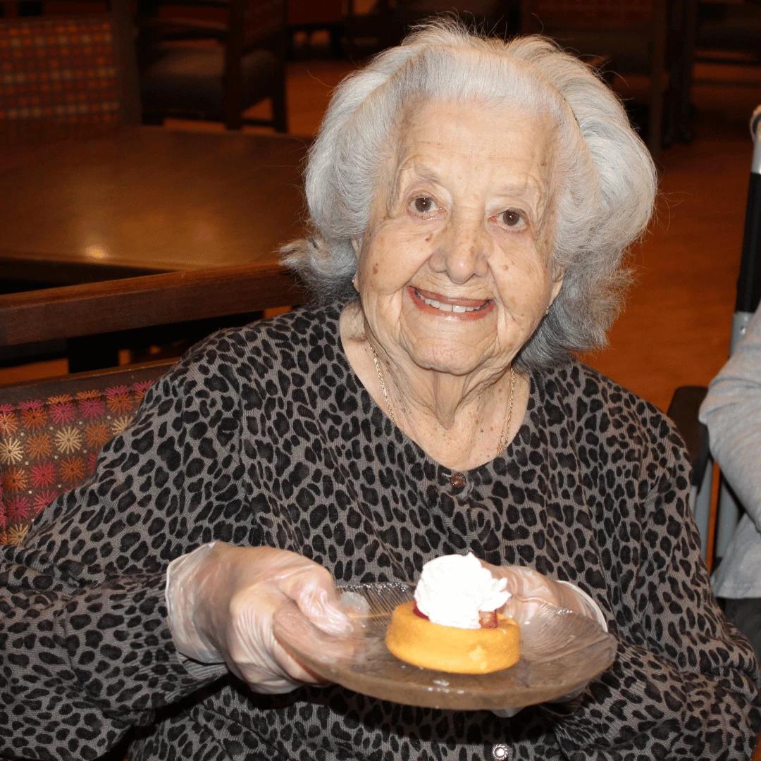 Lake Grove resident serves a sweet treat with a smile.