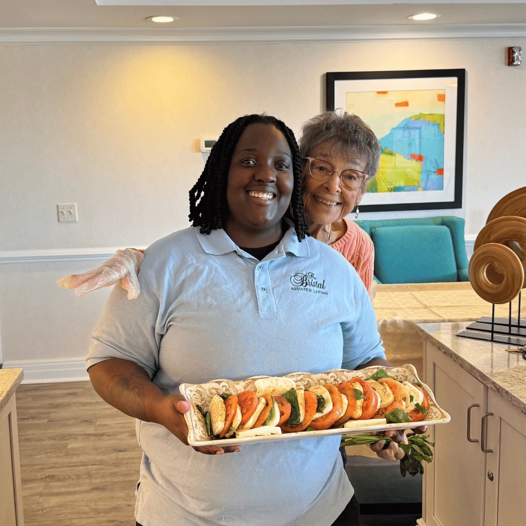 A team member displays the salad made by the Culinary Club at Westbury