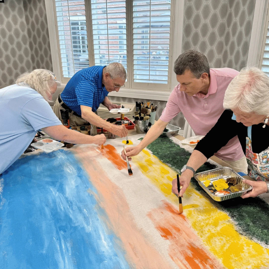 East Northport residents paint a collaborative mural of the Eiffel Tower