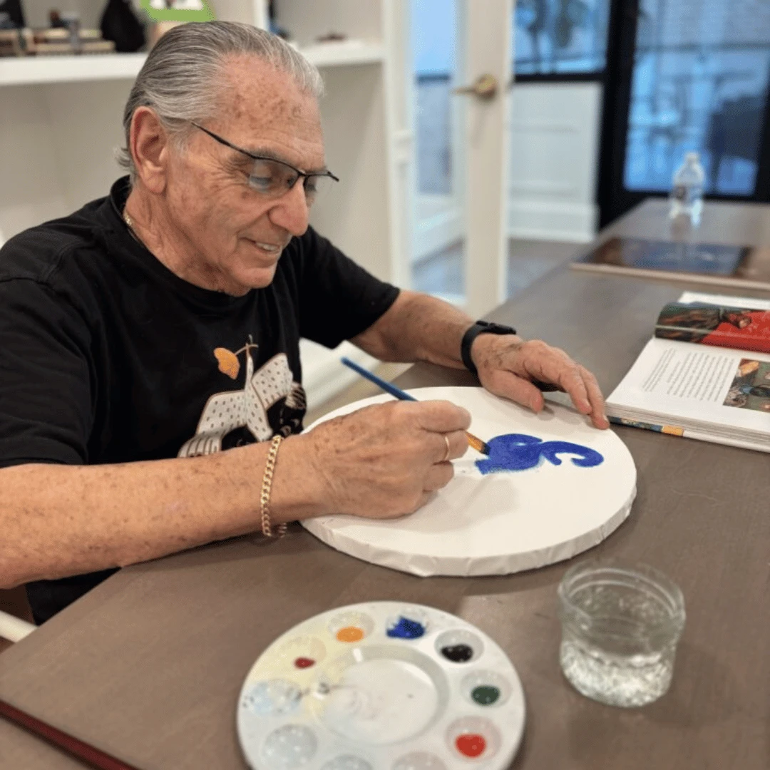 Resident at The Bristal at York Avenue paints using Van Gogh as inspiration