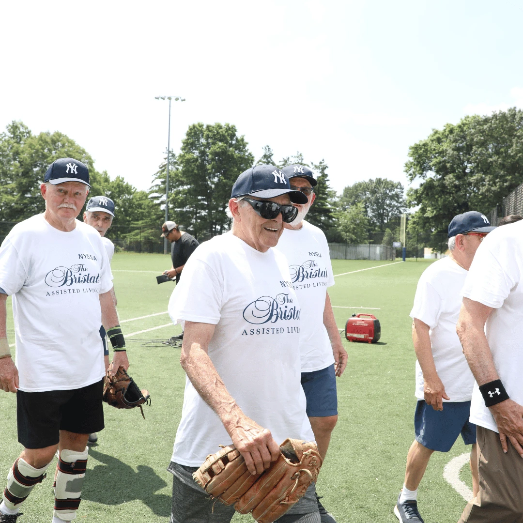 Players wore The Bristal jerseys and Mets or Yankees caps