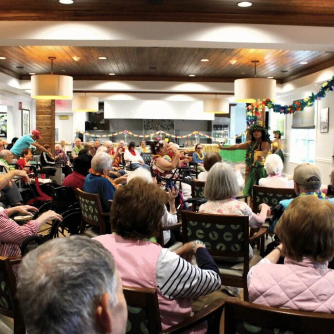 Residents learned hula moves as part of the luau experience