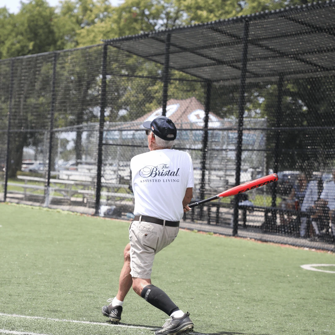 Senior Softball batter hits a homerun