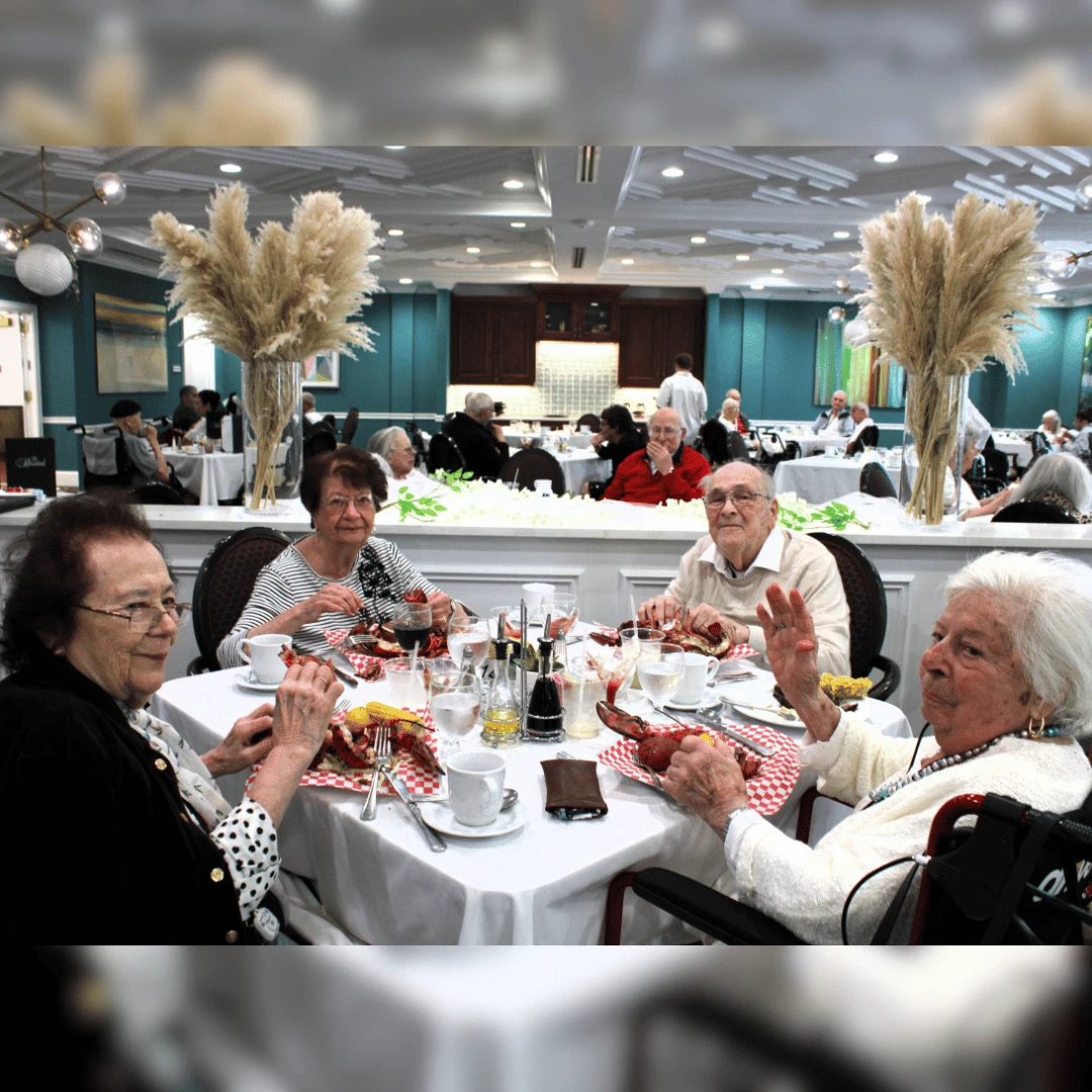 Residents enjoy the delicacies served at The Bristal at Mount SInai Summer Soiree and Lobster Bake