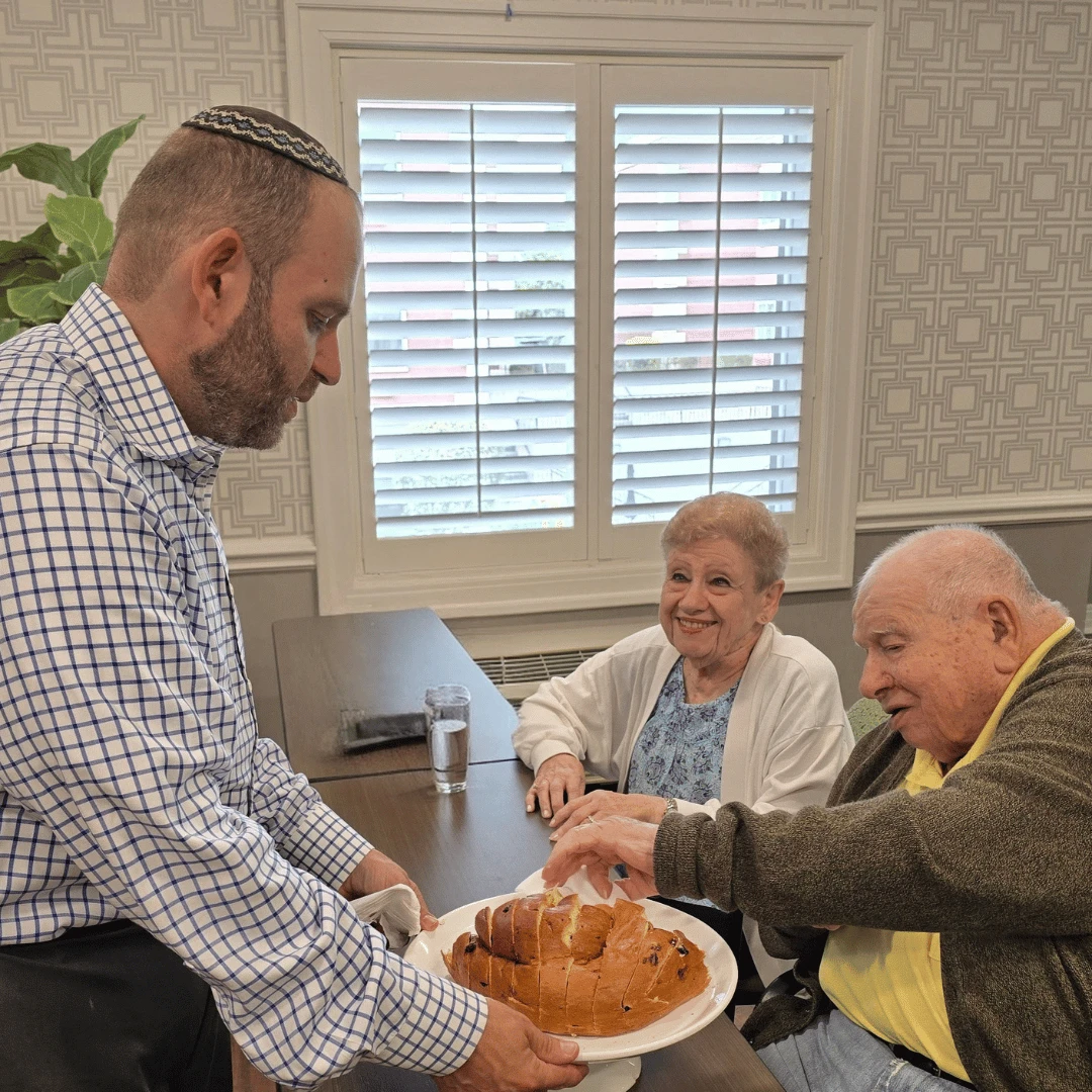 Residents at The Bristal Assisted Living sample the Challah for Rosh Hashanah