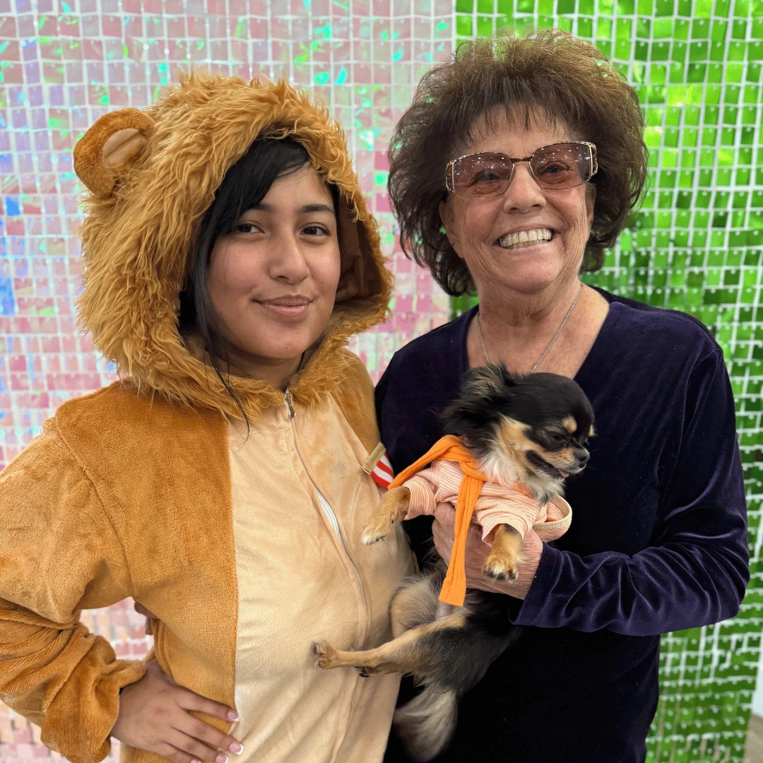 Team members get into the Wizard of Oz spirit for the immersive program at Englewood