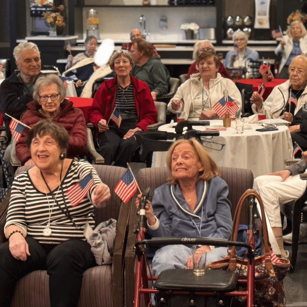 Residents at The Bristal at Armonk wave flags in tribute