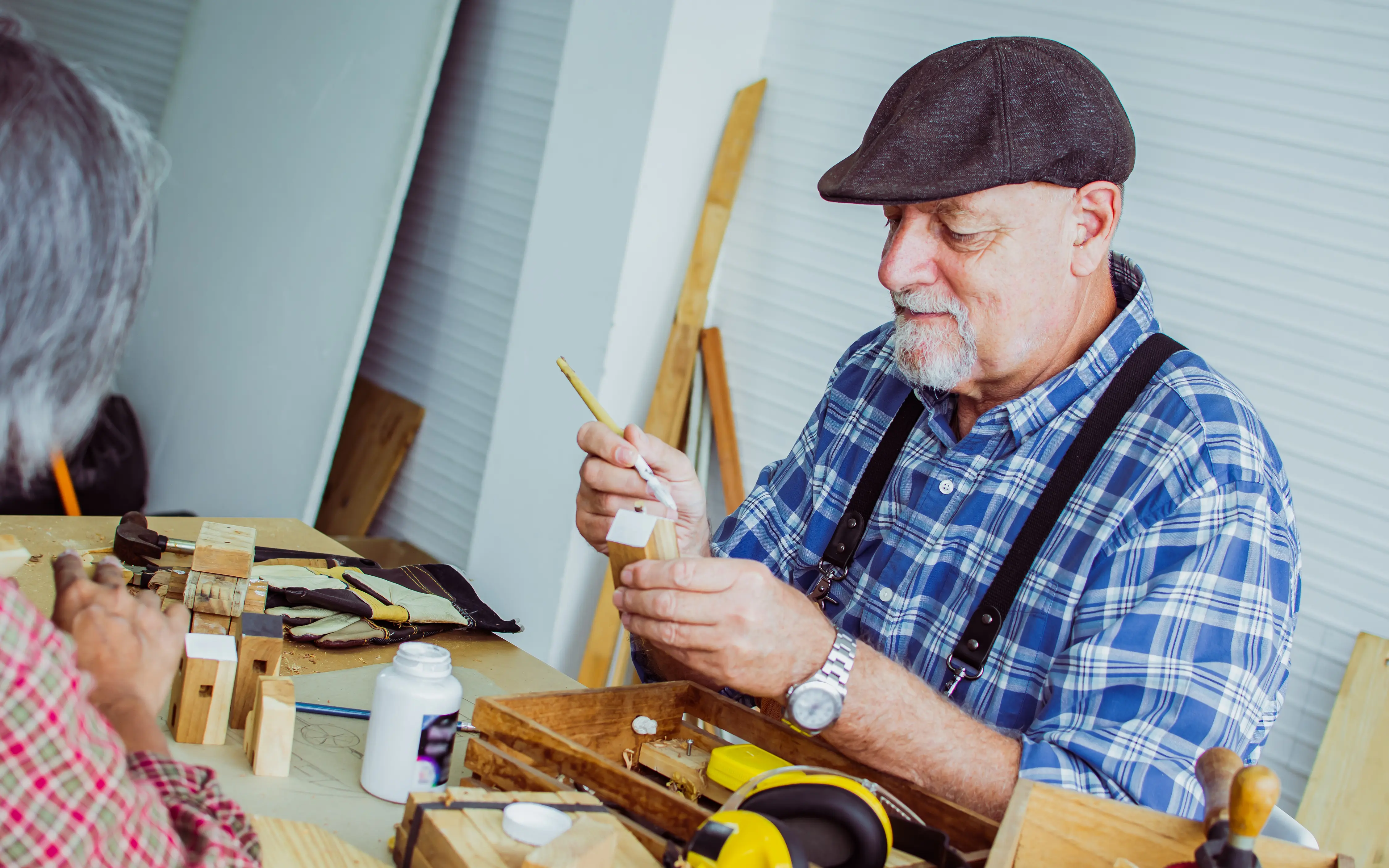 senior man resident of The Bristal pursuing a hobby in lifestyle programming