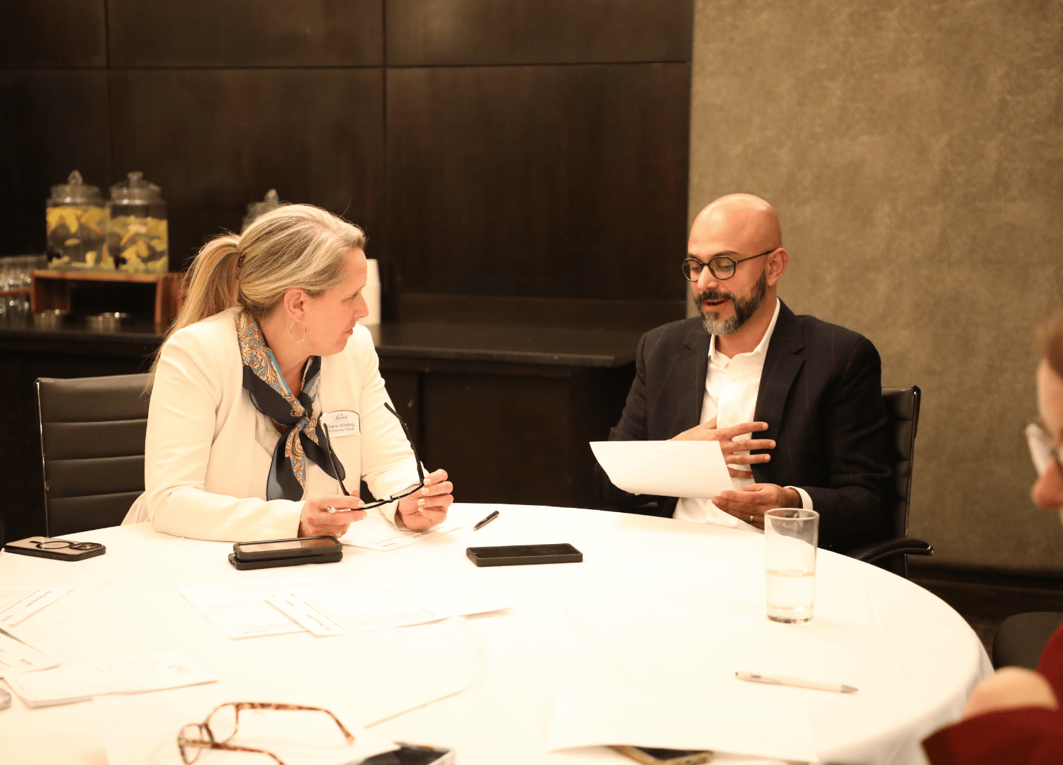 Two leaders collaborate on a problem-solving exercise at the 2026 leadership summit