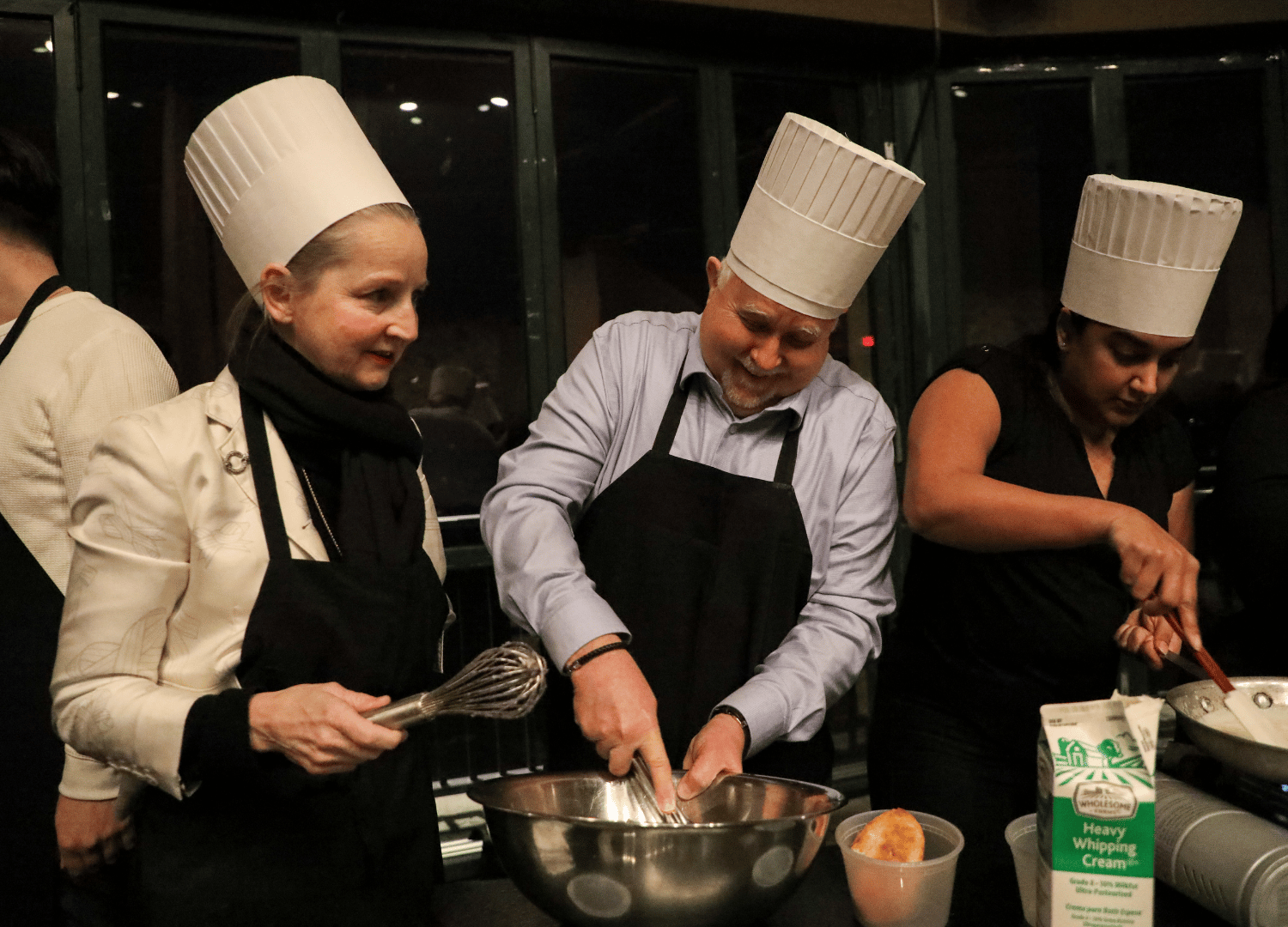 Leaders collaborate as team members in the 2026 Leadership Summit Iron Chef Competition
