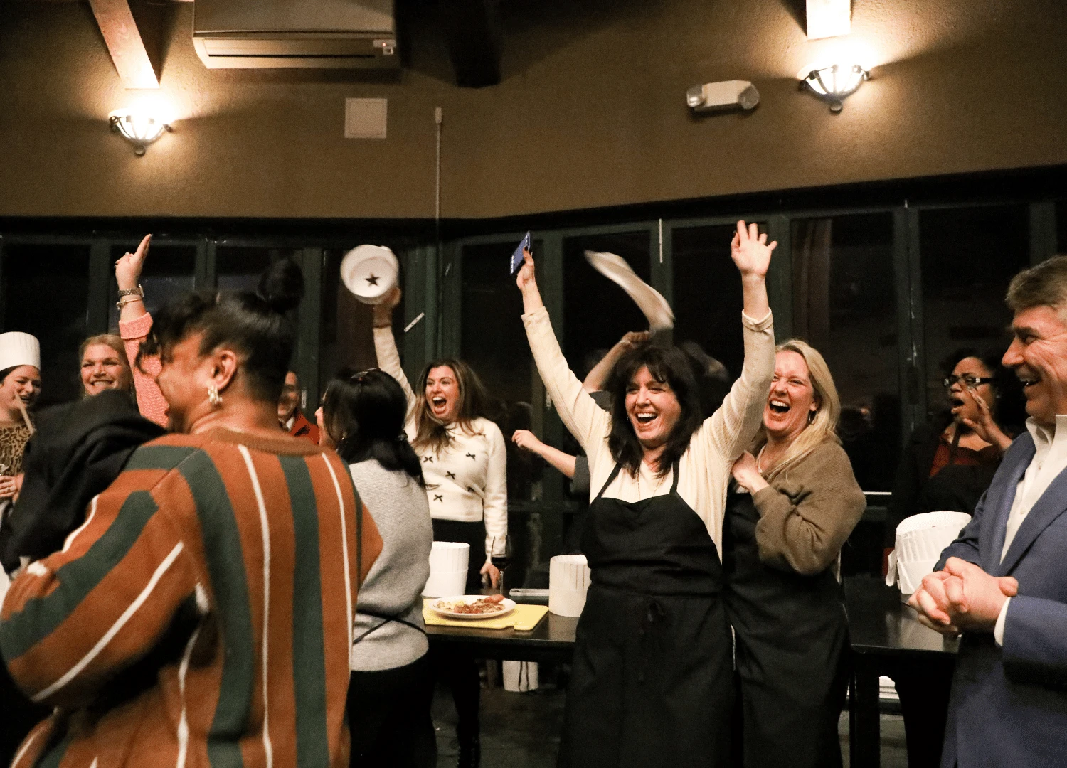 Team celebrates winning dish from Iron Chef challenge at summit