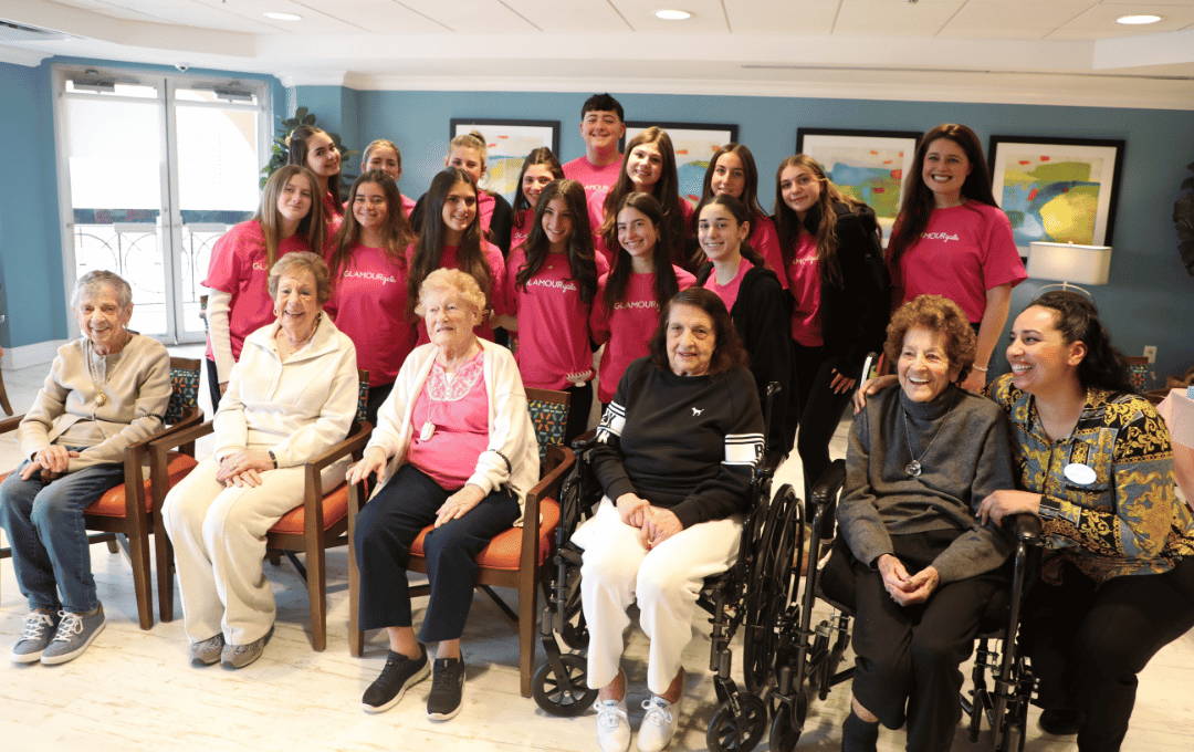 The volunteers from Bellmore High School and residents of The Bristal Assisted Living pose together
