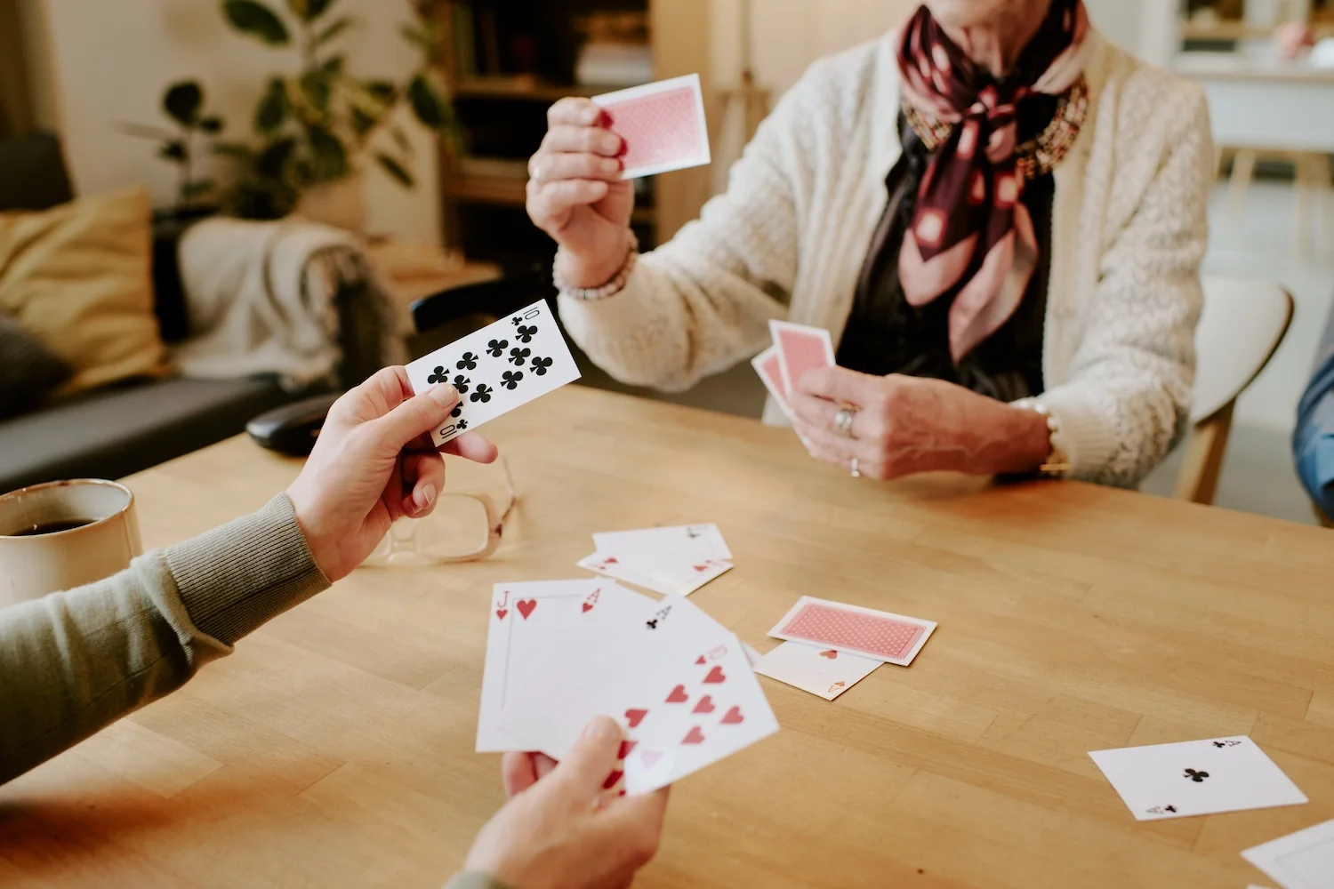 Seniors playing cards at The Bristal Assisted Living