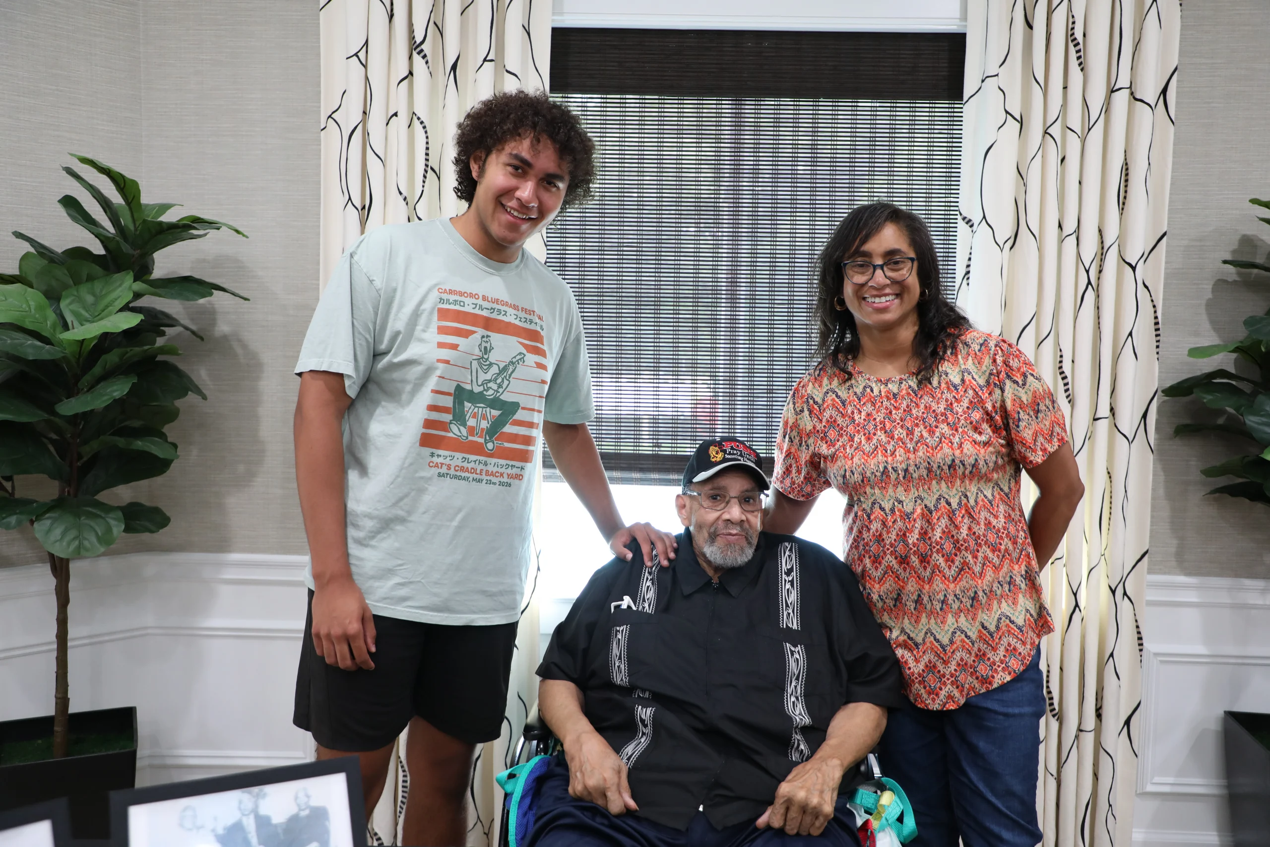 At The Bristal at Holtsville, resident George poses with members of his family who will continue the geneaology search to pursue their family legacy