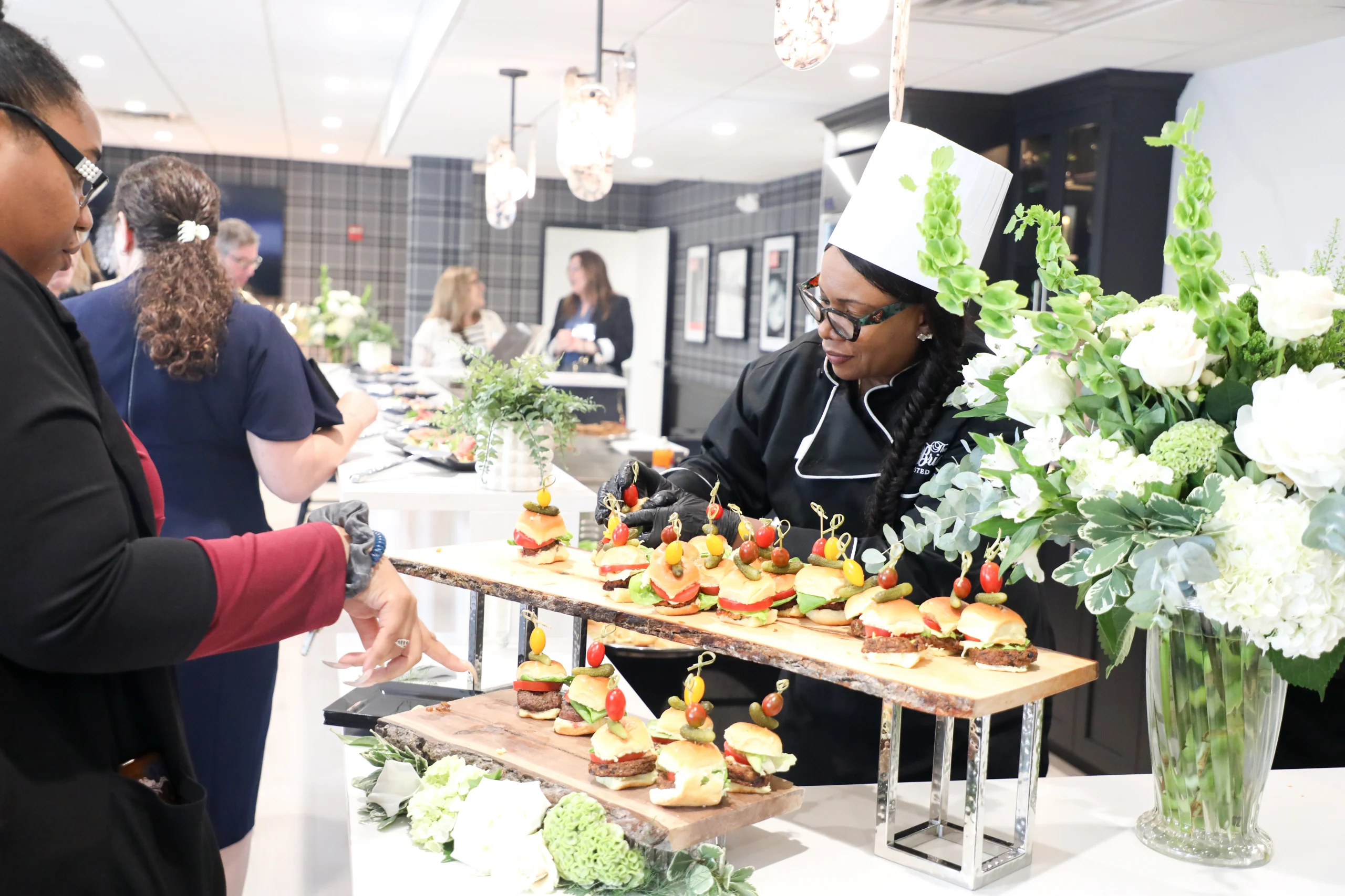 The Bristal at Lynbrook Ribbon Cutting Event - Team Members from Food and Dining assist guests