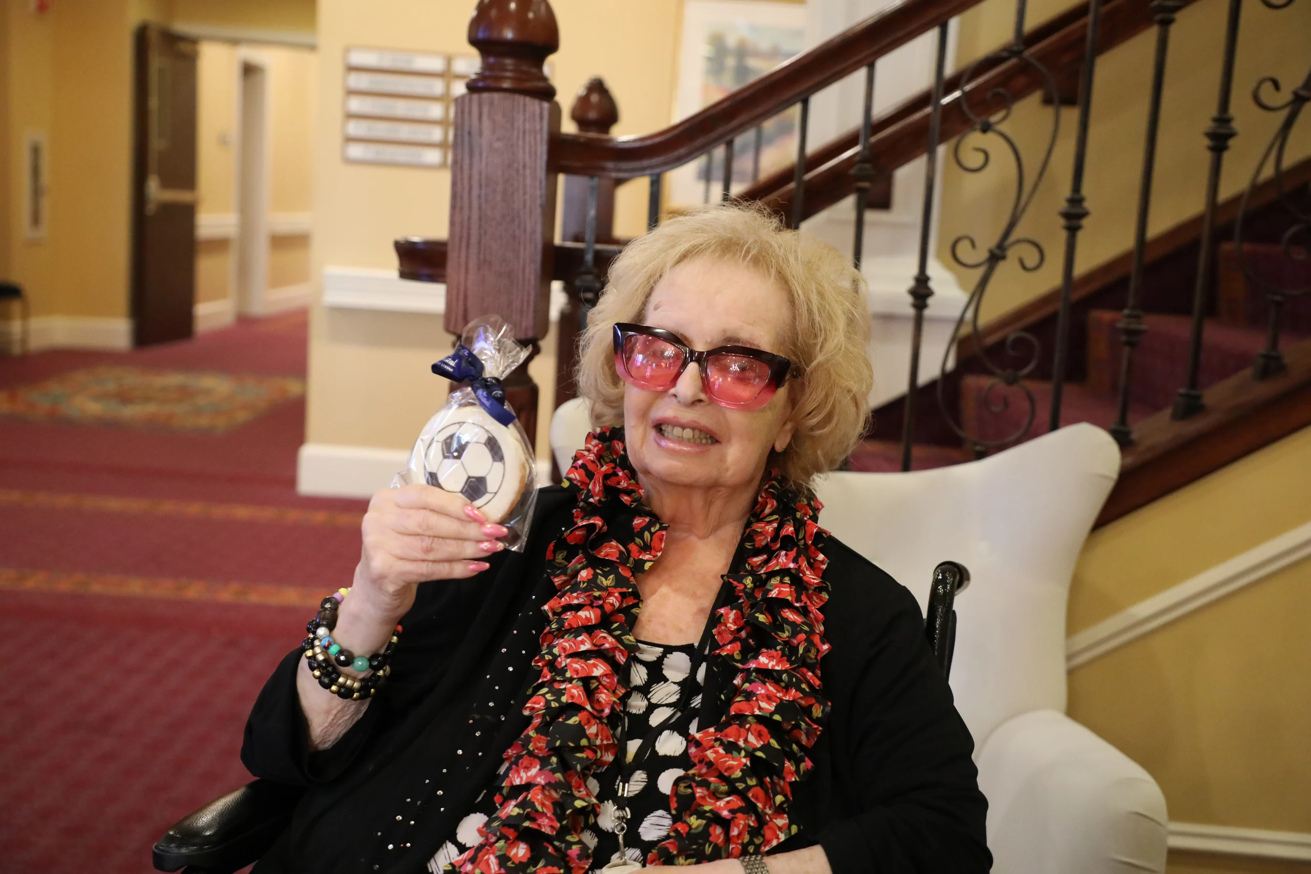 Resident at The Bristal at Lake Grove enjoying some of the party swag at the FIFA World Cup Watch Party